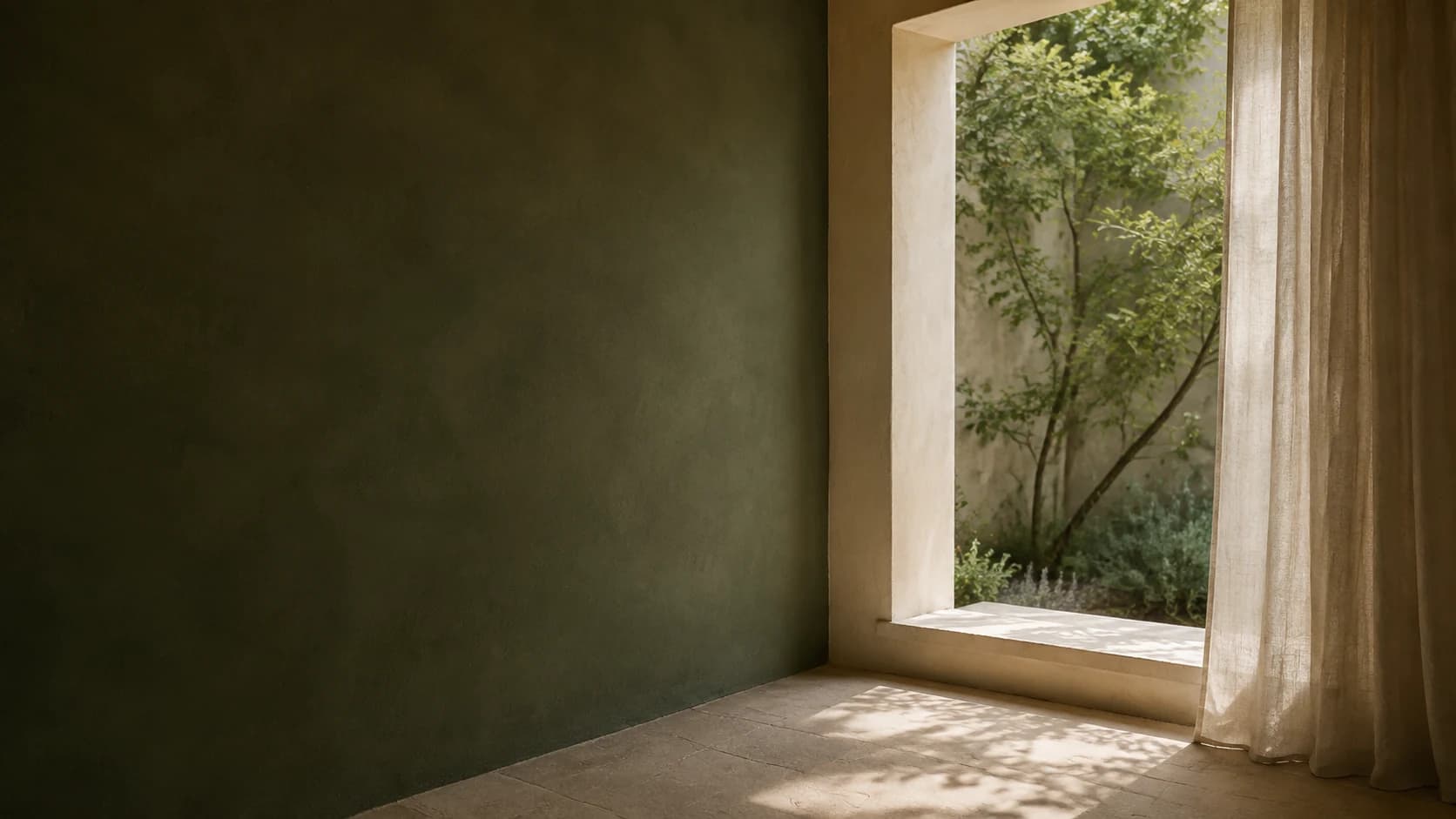 Soft daylight through a linen-framed opening onto a quiet leafy courtyard